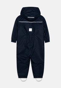 Marinevannavstøtende overall med hette, elastiske mansjetter og en reflekterende stripe over ryggen. Har elastisk bakliv og fotstropper.