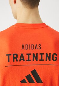 adidas Performance ALL GYM CATEGORY GRAPHIC - Camiseta estampada - bright red