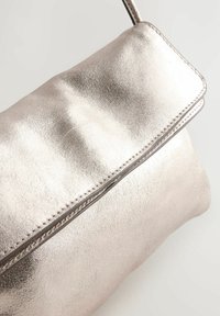Next FLAP - Bandolera - gold