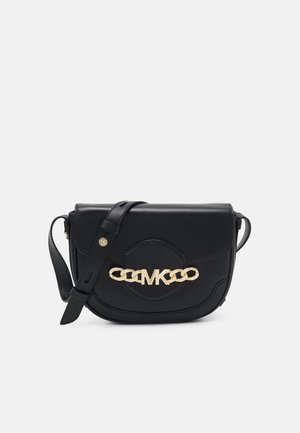 Black leather crossbody bag with a gold chain logo accent, features a structured shape, adjustable strap, and embossed detailing on the front.