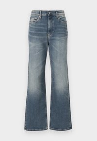 Ljusblå utsvängda jeans i denim. Har en klassisk femfickdesign och blekta detaljer längs benen. Framslutning med knapp och dragkedja.