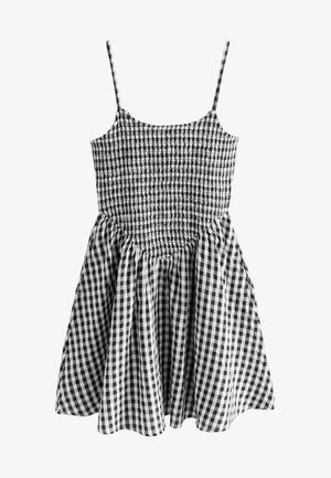 Schwarz-weißer Gingham-Kleid mit verstellbaren Spaghetti-Trägern, gerafftem Oberteil und schwingendem Rock. Verfügt über einen strukturierten Stoff und ein karriertes Muster.