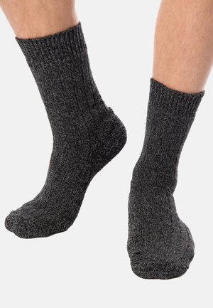 Dark gray ribbed socks featuring a textured knit pattern, mid-calf length, and a seamless toe for comfort. Suitable for casual or outdoor wear.