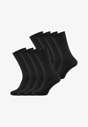 Satz von acht schlichten schwarzen Socken in der Mitte der Wade, gleichmäßig in zwei Reihen auf weißem Hintergrund angeordnet.