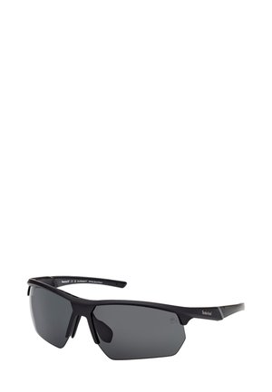 Sunglasses med en ram av svart matt plast, gråtonade linser, vinklad design och detaljer på bågarna. Lämpliga för utomhusbruk.