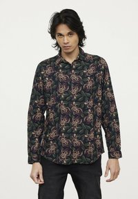 Langsleeve shirt met een donker bloemmotief in paarse en crèmekleurige tinten, met een kraag en een knoopsluiting aan de voorkant.