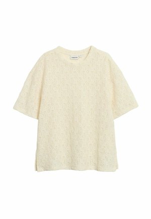 Oversized T-shirt i cremefarve med korte ærmer, tekstureret stof med et diskret løvmønster og sideslids for øget komfort.