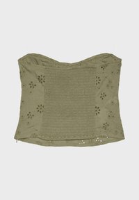 Top court bustier vert olive avec panneau central froncé et broderie florale à œillets sur les côtés et l’ourlet inférieur.