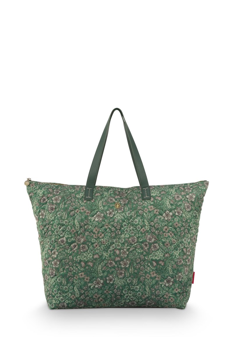 Groene tas met bloemenpatroon, gemaakt van geborduurd stof. Voorzien van twee groene leren handvatten en een ritssluiting.