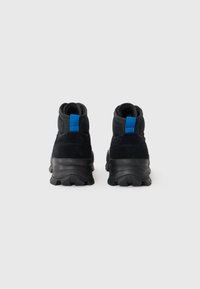 Black high-top sneakers made of suede and mesh, featuring a blue accent on the heel, textured rubber sole, and padded ankle support.