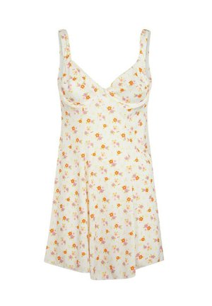 Vestaglia floreale color crema, caratterizzata da piccoli fiori arancioni e rosa, spalline regolabili e un design svasato con una morbida consistenza del tessuto.