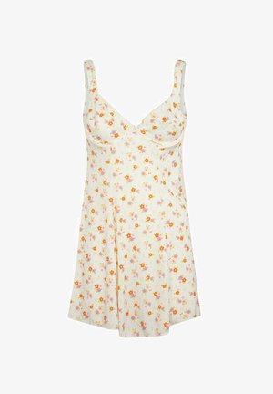 Vestaglia floreale color crema, caratterizzata da piccoli fiori arancioni e rosa, spalline regolabili e un design svasato con una morbida consistenza del tessuto.
