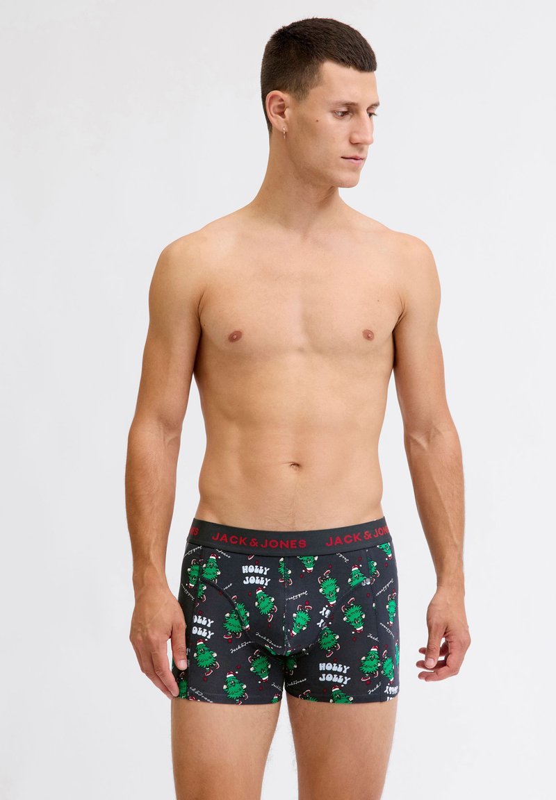 Caleçons boxers noirs avec un motif de monstre en cartoon vert et une ceinture rouge "JACK & JONES". Tissu doux avec un ajustement serré.