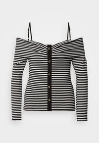 Top à rayures noir et blanc, décoletté et à manches longues, avec une fermeture à boutons sur le devant et des bordures contrastantes noires. Tissu en jersey lisse.