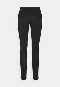 Leggings neri con alta vita, realizzati in tessuto elasticizzato. Presentano una texture liscia e una tasca posteriore con zip per piccoli oggetti.