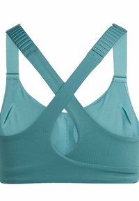 Hellblauer Sport-BH aus einem weichen, dehnbaren Stoff. Mit Überkreuzträgern, Aussparungen und subtilen Rippdetails.