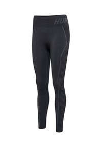 Zwarte geribbelde sportlegging met brede tailleband, subtiele zijstrepen en chevronpatroon langs de buitenkant van het linkerbeen.