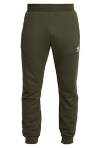 Olivgrön sweatpants med en slät yta, elastisk midja och ribbade mudd. Har sidofickor och en vit logotyp på låret.
