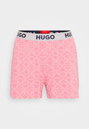 Pink shorts featuring an intricate white geometric pattern, elastic waistband with navy "HUGO" logo, and a soft fabric texture.