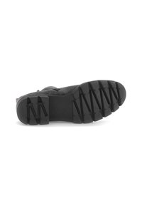 Semelle de botte noire avec un motif de rainure en zigzag profond et la marque "Gabor" visible au centre de la semelle.
