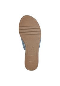 Blå slip-on sko med en texturerad brun gummisula, med räfflor för grepp. TOMS-logotypen på sidan och storlek 37 angiven.
