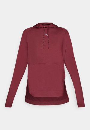 Burgundy hoodie made of soft fabric, featuring a kangaroo pocket, drawstring hood, and side slits for ease of movement.