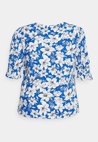 Blusa floreale blu con fiori bianchi e neri. Maniche corte a palloncino, scollo rotondo e vestibilità ampia con una texture liscia.