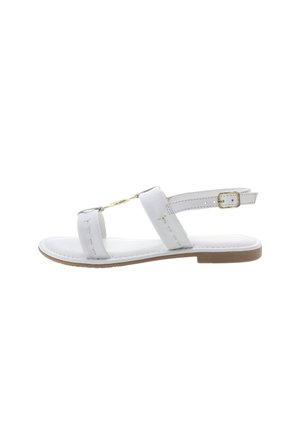 White sandal with two wide straps and ankle buckle, featuring gold-tone hardware, flat sole, and stitched detailing along the edges.