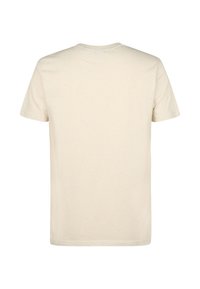 T-shirt à manches courtes de couleur crème, fabriqué en coton doux, présentant un col rond et une texture lisse avec de fines nuances subtiles.
