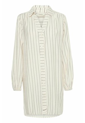 Long-sleeve blouse made of lightweight fabric, featuring a split neck, button closure, and vertical cream and navy stripes. Elasticized cuffs.