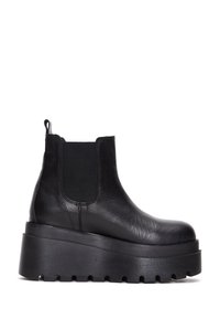 Black leather ankle boot with elastic sides, thick textured platform sole, and pull tab. Features a smooth finish and rounded toe design.
