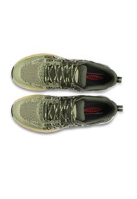 Green athletic shoes with a textured mesh upper, light-colored sole, and black accents. Features flat laces and a pull tab at the heel.