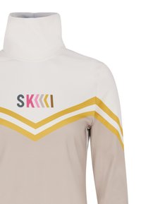 Hochgeschlossenes Sportoberteil in Creme mit beiger Unterteilung, ausgestattet mit Chevronstreifen in Weiß und Gelb sowie einem mehrfarbigen Logo auf der Brust.