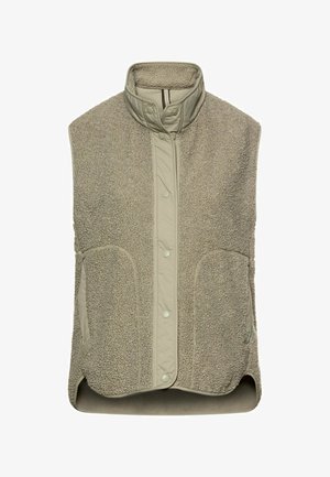 Veste sans manches en polaire beige avec col montant, fermeture à boutons-pression et deux poches avant, conçue pour la chaleur et un port décontracté.