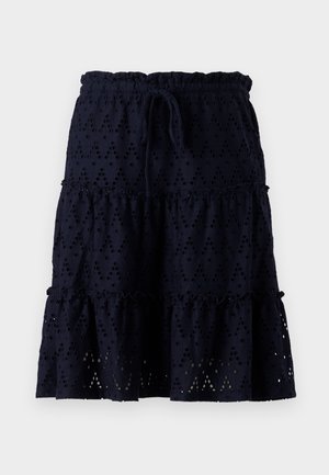 Navy blue skirt with an elastic waistband and drawstring. Features eyelet pattern, tiered ruffles, and a textured fabric.