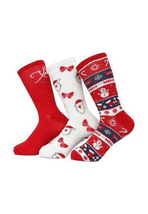 Tre paia di calzini a tema natalizio: uno rosso uni, uno bianco con fiocchi rossi e volti di Babbo Natale, e uno decorato con pupazzi di neve e motivi festivi.