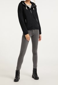 Schmuddelwedda Vodotěsná bunda - black