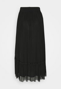 Jupe midi noire avec taille élastique et ourlet à volants froncés, réalisée en tissu léger et transparent.