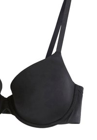 Must rinnahoidja, millel on pehmendusega tassid, sile tekstuur, reguleeritavad rihmad ja tagaküljel konksude ja aasa kinnitused.