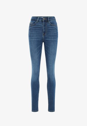 Schmal geschnittene, hochtaillierte Jeans aus dunklem Denim. Mit fünf Taschen, Gürtelschlaufen und Kontrastnähten. Glatte Textur mit leichtem Verblassen.