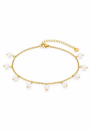 Bracelet chaîne doré avec plusieurs breloques en perles blanches et une chaînette d’extension réglable, présenté sur fond blanc.