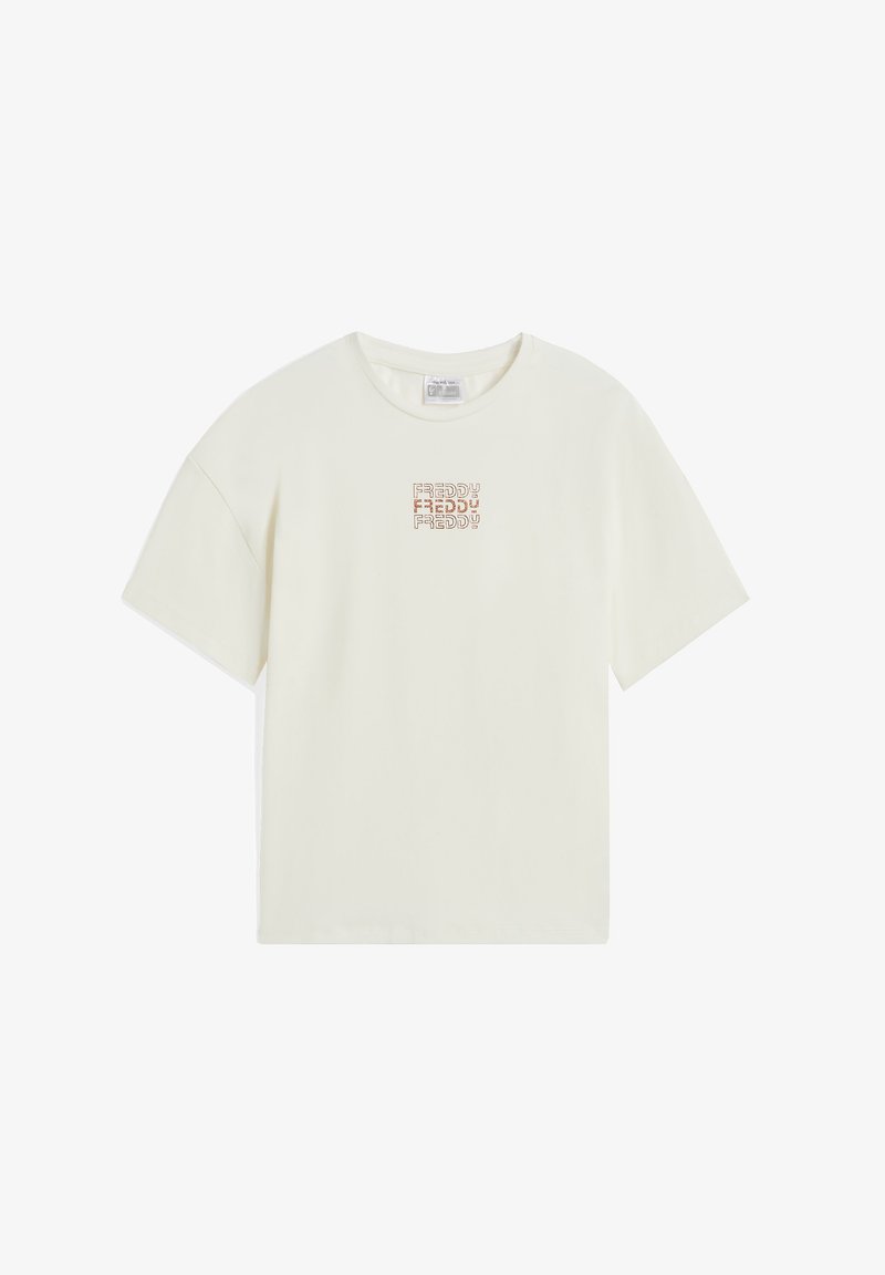 Camiseta de algodón color crema clara con escote redondeado y mangas cortas. Presenta un pequeño logo texturizado en color naranja marrón en la parte delantera.