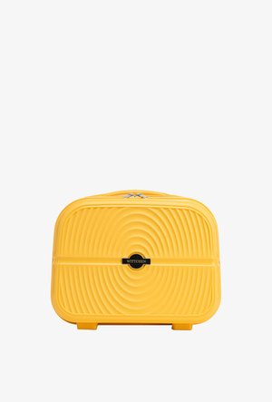 Maleta rígida de color amarillo brillante con diseño de círculos concéntricos texturizados, cremallera plateada y logo negro de Wittchen en el centro.