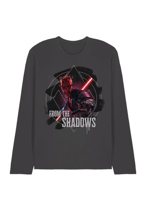 Dunkelgraues Langarmshirt mit einer rot-schwarzen gehörnten Figur, die ein rotes Lichtschwert hält, der Text lautet "AUS DEN SCHATTEN."