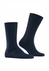 Marineblaue gerippte Socken mit einem strukturierten Bündchen und verstärkter Ferse, aus weichem Material mit glatter Oberfläche, entworfen für Komfort.