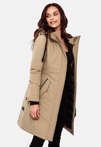 Beige puffer coat with a removable hood, front zipper, side pockets, and black accents. Features a smooth exterior and quilted lining.