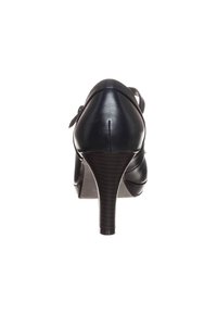 Svart läder högklackad sko med en smal klack och en slät yta. Har en rem baktill och en rundad tådesign.