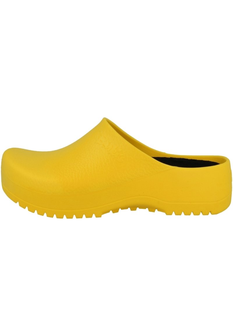 Gelbe Gummi-Clogs mit texturierter Oberfläche, breiter geschlossener Zehenpartie und offenem Fersenbereich. Mit einer geriffelten Sohle für Traktion und Stabilität.