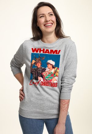 Sweatshirt gris avec un motif sur le devant comprenant "WHAM!" et "Last Christmas". L'illustration montre deux personnages en tenue festive sur un fond bleu.