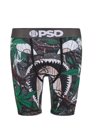 Boxer negro con estampado de hojas y ramas verdes, con diseño frontal de boca y ojos de tiburón blancos y cintura PSD negra.